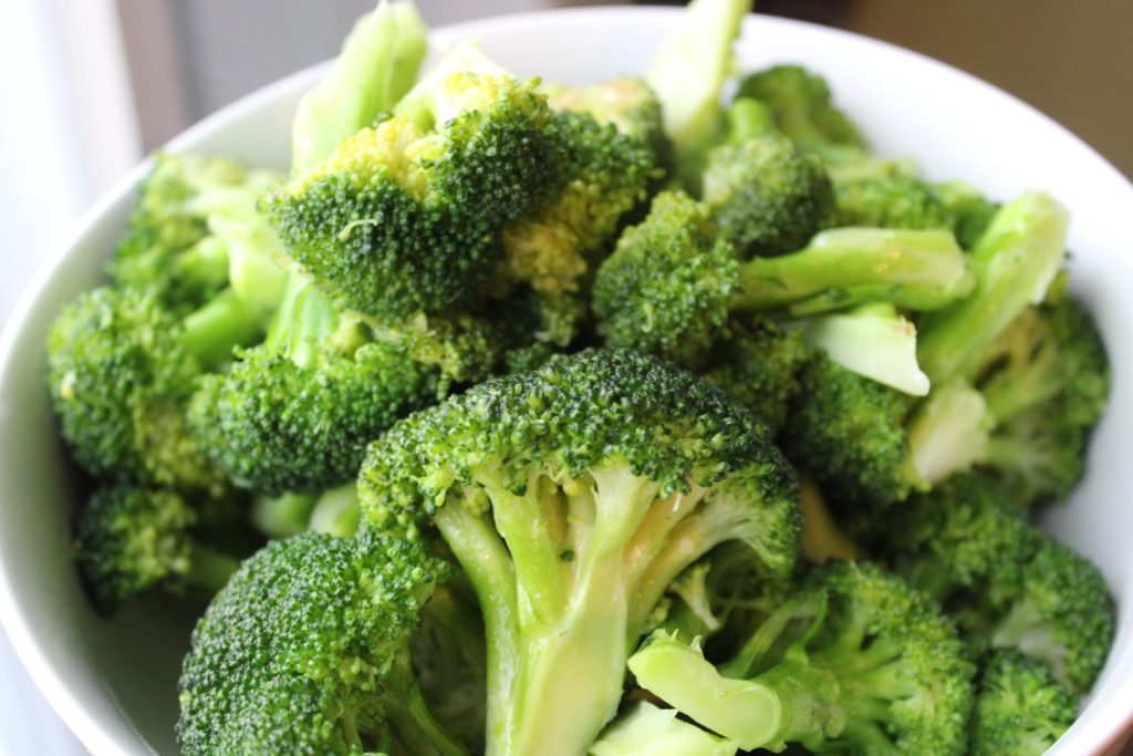 green broccoli on white ceramic plate